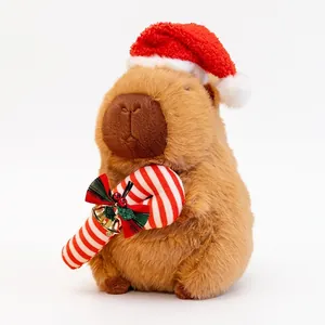 Adorable peluche capybara de Noël avec bonnet de Père Noël et sucre d'orge décoratif