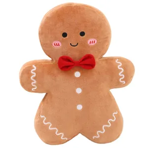 Coussin en peluche bonhomme en pain d'épices avec nœud papillon rouge pour Noël