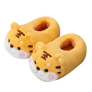 Cute yellow cartoon tiger plush slippers for winter indoor warmth and non-slip comfort.