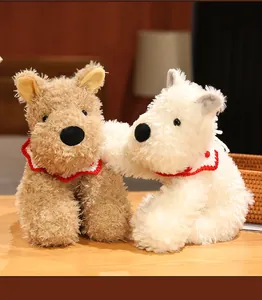 Close-up of scruffy West Highland White Terrier plush toys with crochet collars