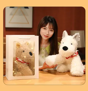 Cute Westie dog plush toy set with warm string lights in a white gift bag window