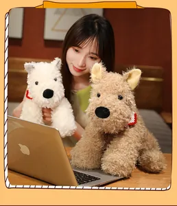 Close-up of fluffy white and brown Westie plush dolls with a model