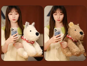 Young woman holding two fluffy scruffy Westie plush dogs in white and brown