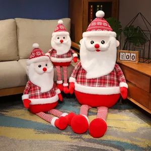 Set of plaid Santa Claus plush toys in three sizes for Christmas decor.