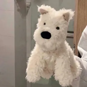 Fluffy white Westie dog plush toy with soft fur and cute expression.