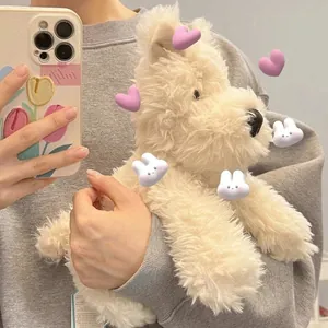 Fluffy West Highland White Terrier plush toy held in arms, soft and cute white dog doll