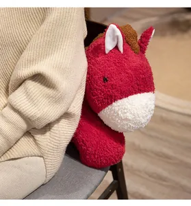 Detail shot of a soft red plush horse mascot with a fluffy texture for the 2026 Zodiac Year.