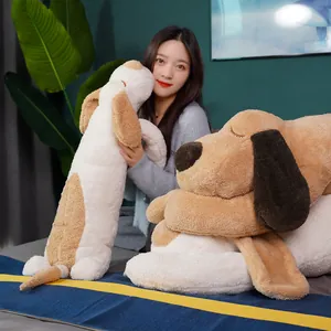 Soft long plush dog hugging pillow for sleeping shown in a cozy indoor bedroom setting