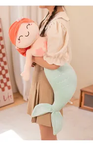 Soft decorative mermaid plush doll being held to showcase high-quality texture and size detail