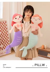 Soft mermaid plush pillow toy for kids featuring purple and green fishtails