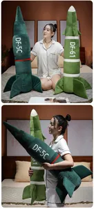 Close-up of missile shaped plush pillows DF-5C and DF-61 in a bedroom