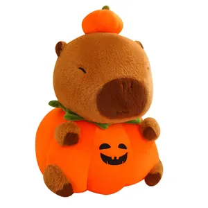 Cute Capybara plush toy dressed in a Halloween pumpkin outfit on a white background