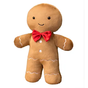Cute gingerbread man plush pillow with red bow tie, soft Christmas holiday decor gift