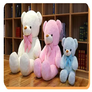 Sammlung von weißen rosa und blauen Teddybären in verschiedenen Größen mit Schleifen