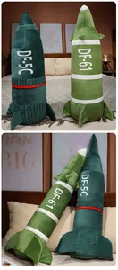 Detail of DF-5C and DF-61 missile-shaped plush pillows in a bedroom setting