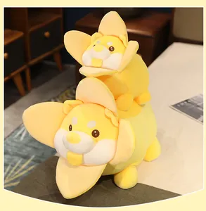 Detail view of two stacked banana dog plush toys in a cozy bedroom setting