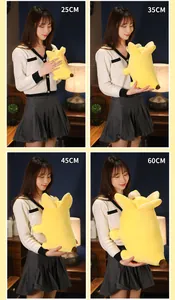 Comparison of four different sizes of creative banana dog plush toy held by a model
