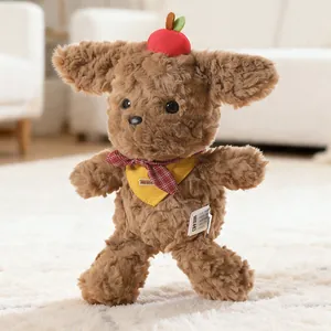 Cute brown Teddy dog plush toy with a red apple decoration and yellow neckerchief