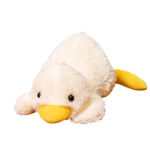 Adorable plush lying duck toy with soft white fur and bright yellow beak on white background
