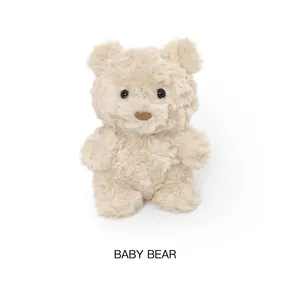 Detail shot of a small cream plush teddy bear doll suitable as a cute birthday gift