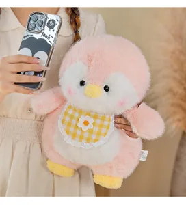 Soft pink penguin plush toy featuring a cute yellow checkered bib with a flower