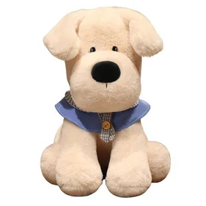 Cute beige Labrador puppy dog plush toy with blue collar and wooden button detail