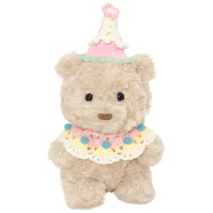 Cute plush teddy bear doll wearing a knitted birthday hat and colorful collar accessory