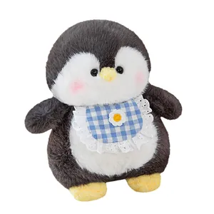 Cute plush penguin doll wearing a blue checkered lace bib for home decoration
