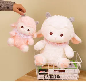 Detail of two cute soft lamb plush toys with lace collars sitting in a metal basket