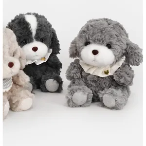Group of three cute plush puppy dolls with ruffled collars on a plain white background.