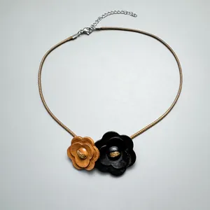 Handmade vintage wooden flower choker necklace with adjustable brown leather cord.