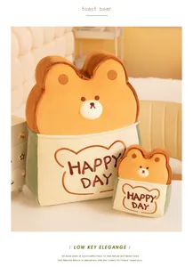 Detailed macro view of cute toast bear plush cushions with Happy Day embroidery