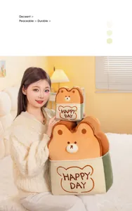 Adorable toast bear plush cushions in two sizes held by a model in a warm bedroom setting