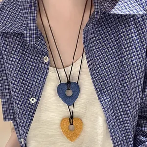 Handmade large lava stone hollow heart necklace on long leather cord for women