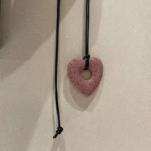 Minimalist pink lava stone hollow heart pendant necklace with adjustable black cord cord