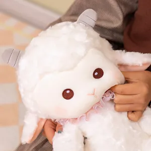 Soft white plush sheep toy with pink ruffle collar and cute facial expression