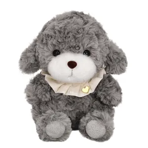 Cute gray puppy plush toy with cream ruffle collar and gold heart charm detail