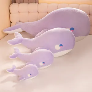 Four cute purple whale plush toys in different sizes displayed as soft sleeping body pillows