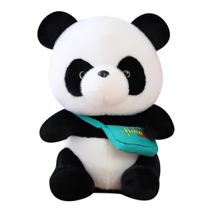 Adorable giant panda plush toy wearing a green messenger bag, perfect kid souvenir.