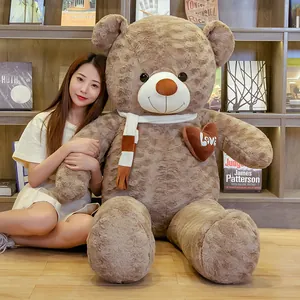 Soft giant brown plush teddy bear with striped scarf and love heart for Valentine's gift