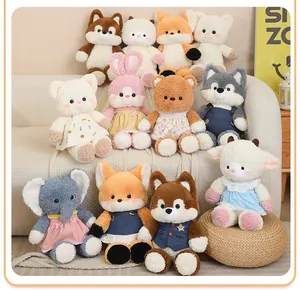 A charming collection of various forest animal plush toys displayed on a sofa