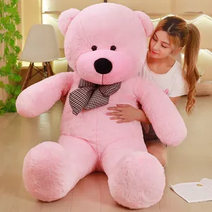 Giant pink teddy bear plush toy with a classic plaid bow tie for a girls birthday gift