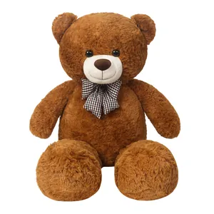Large brown teddy bear plush toy with a checkered bow tie on a plain white background.