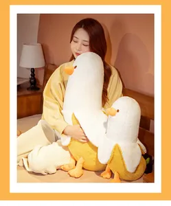 Close-up of a girl hugging a large and small soft banana duck plush toy in bedroom
