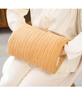 Detail shot of the soft knitted plush hand warmer pillow with fantasy embroidery