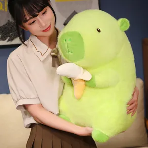 Adorable soft green capybara plush toy holding a peeled banana, perfect gift for kids
