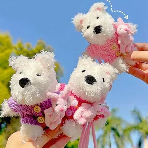 Cute plush West Highland White Terrier keychain wearing a colorful knitted sweater