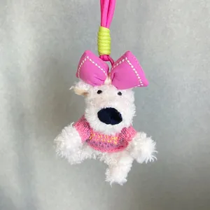 Adorable plush West Highland Terrier dog keychain featuring pink bow and knitted sweater