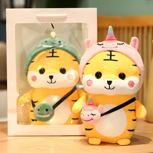 Simpatico peluche tigre in costumi da dinosauro e unicorno con confezione regalo bianca