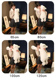 Size comparison of soft white polar bear plush pillows in 65cm to 120cm held by a model